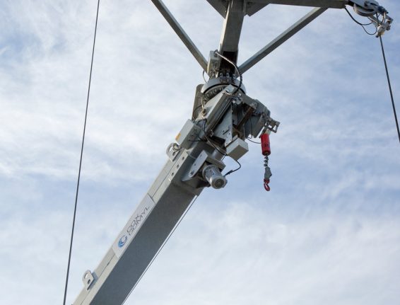 How do CoxGomyl design and select building maintenance systems?